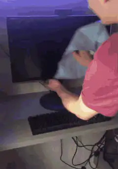 Person cleaning computer monitor