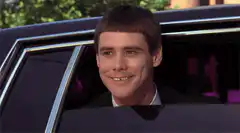 Jim Carrey smiling in a car