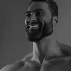 Muscular man smiling and looking down