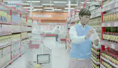 Man checks price in supermarket