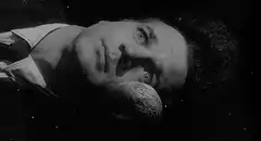 Man floating in space with moon