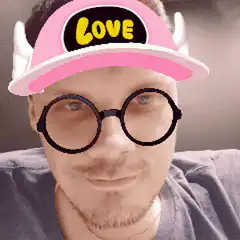 Man with pink love hat and glasses