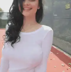 Woman in white shirt on tennis court