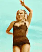 Woman in black swimsuit dancing