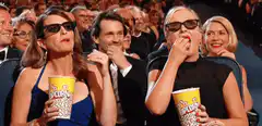 women eating popcorn in 3d glasses