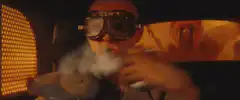 Bald man smoking in car