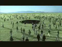 Crowd walking into a pit