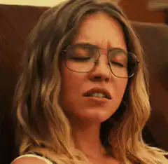 Woman with glasses making a face