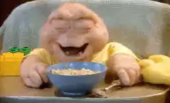 Baby Bop laughing at cereal