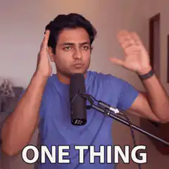 Man gesturing with one hand saying one thing