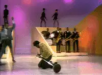 Man on scooter gets tackled by dancers