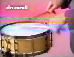 person playing drumroll on snare drum