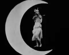Woman dancing on crescent moon