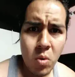 Man's face reacts with shock