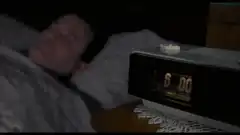 man smashes alarm clock