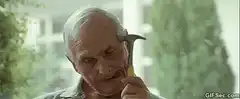 Old man hammering his head