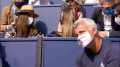 Man in mask gives thumbs up