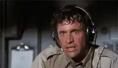 Man sweating profusely under headphones