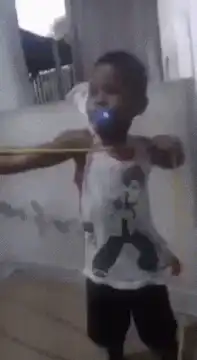 Toddler with pacifier dancing