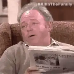 Archie Bunker reading newspaper
