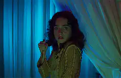 Young girl with knife and bloody hand