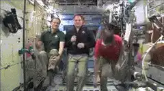 Astronauts floating in space station