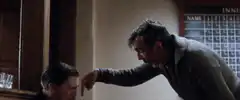 Man points finger at another man's nose