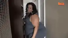 Woman in blue dress twerking