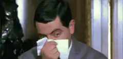 Mr. Bean sneezes and gets tissue stuck in nose
