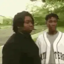 Two men talking outside