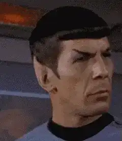 Spock raises eyebrow and looks down