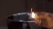 Man in bathtub ignores burning trash can