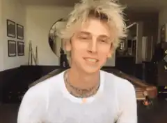 Machine Gun Kelly heart hands