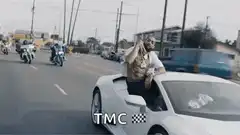 Snoop Dogg in a white Lamborghini