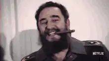 Man with cigar laughs and points