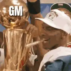Michael Jordan smoking with championship trophy