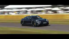 Black Porsche Panamera Turbo S E-Hybrid on track
