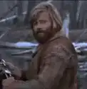 Dwight Schrute smirking in the woods