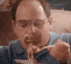 Man eating messy food with a spoon