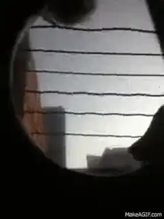 Hand drawing wavy lines on window