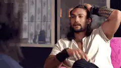 Jason Momoa running hands through hair