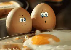Two eggs watching a fried egg