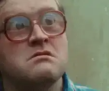 Man with glasses eyes widen in shock