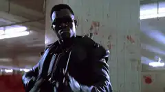 Blade adjusts his collar