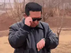 Kim Jong Un checks watch