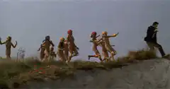 The Wombles running off a cliff