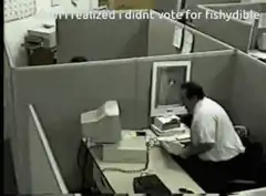 man throws computer monitor in office