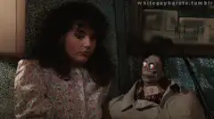 Woman staring at zombie puppet