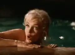 Marilyn Monroe laughing in a pool