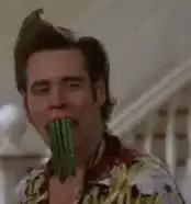 Jim Carrey with green beans in mouth